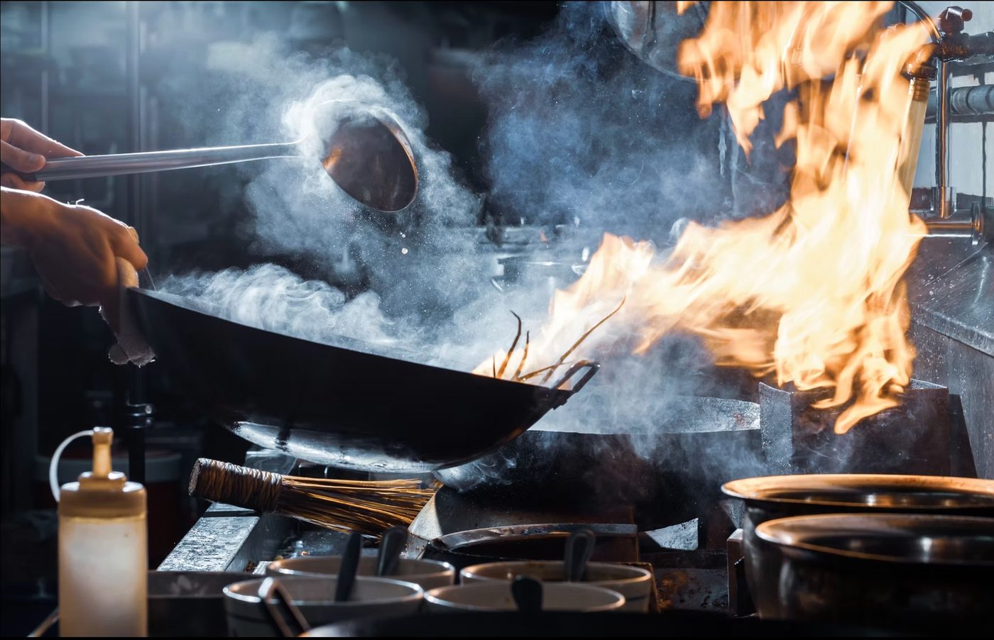 Flames rising from a hot wok in the kitchen